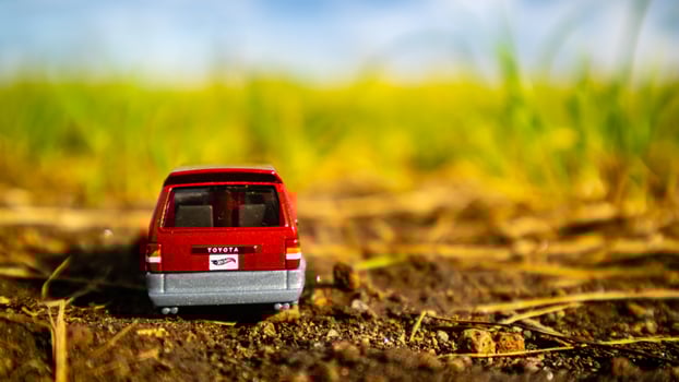 South Minahasa, Indonesia  February 2023, toy car on green grass photo