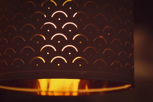 Close up of textile lamp shade in the dark photo