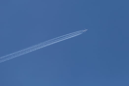 plane flying in a blue sky photo
