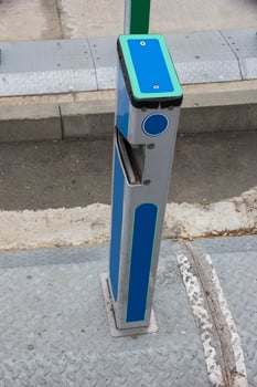 Empty bike sharing station. Modern blue bikes at city rental station on sunny day photo