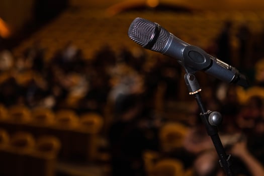 microphone in the background of the audience photo