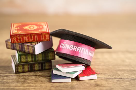 Graduation hat on book with copy space, learning university education concept. photo