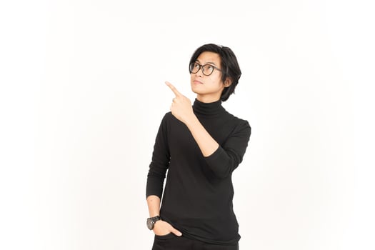 Showing Product and Pointing Side using forefinger Of Handsome Asian Man Isolated On White photo