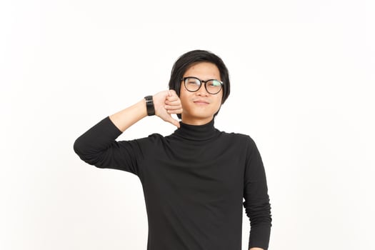 Showing Thumbs Down Of Handsome Asian Man Isolated On White Background photo