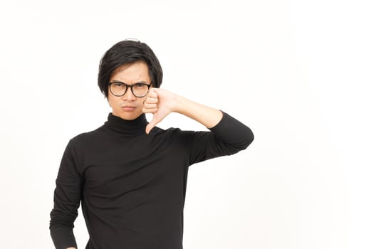Showing Thumbs Down Of Handsome Asian Man Isolated On White Background photo