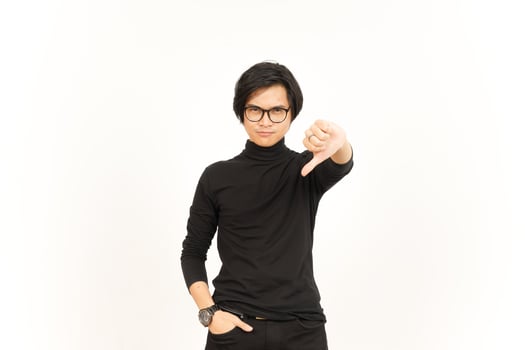 Showing Thumbs Down Of Handsome Asian Man Isolated On White Background photo