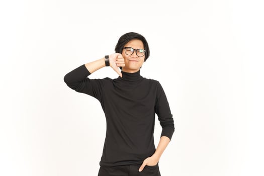 Showing Thumbs Down Of Handsome Asian Man Isolated On White Background photo