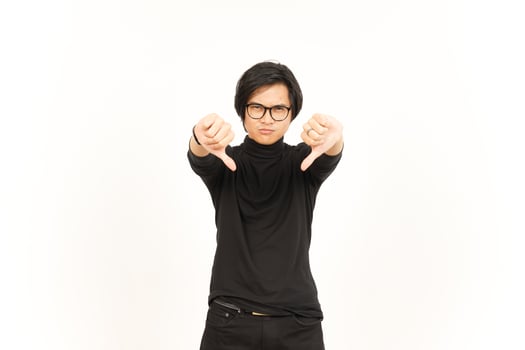 Showing Thumbs Down Of Handsome Asian Man Isolated On White Background photo