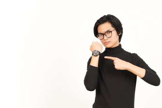 Pointing to watch and Angry for late Of Handsome Asian Man Isolated On White Background photo