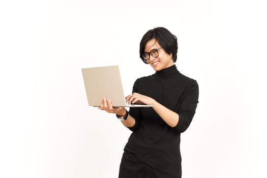Standing and Using Laptop Of Handsome Asian Man Isolated On White Background photo