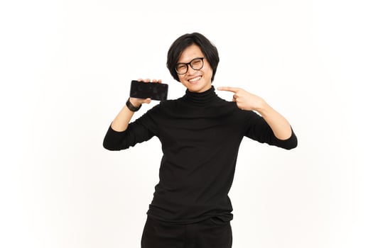 Showing Apps or Ads On Blank Screen Smartphone Of Handsome Asian Man Isolated On White Background photo