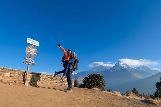 A young traveller trekking in Poon Hill view point in Ghorepani, Nepal photo