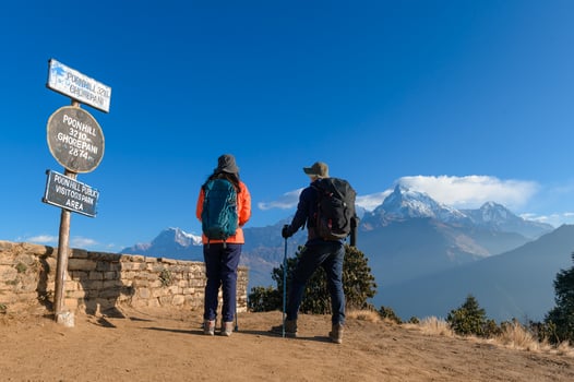A young traveller trekking in Poon Hill view point in Ghorepani, Nepal photo