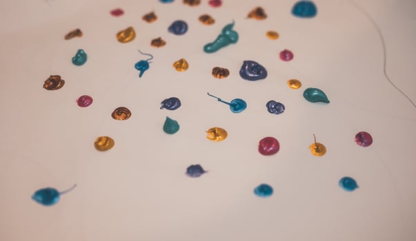 Colorful paint drop splats background on paper , kid activity. photo