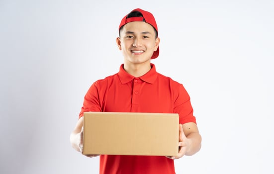 portrait of asian delivery man on white background photo
