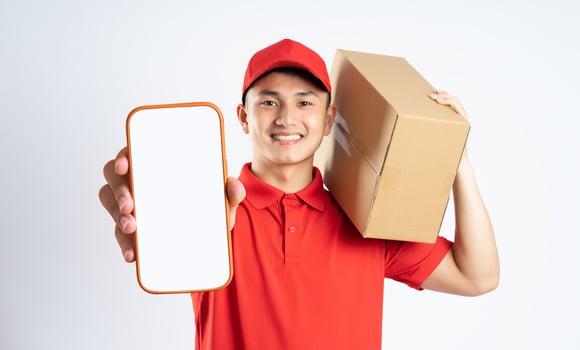 portrait of asian delivery man on white background photo