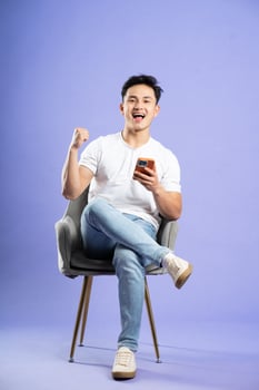image of asian boy posing on purple background photo
