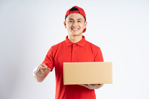 portrait of asian delivery man on white background photo