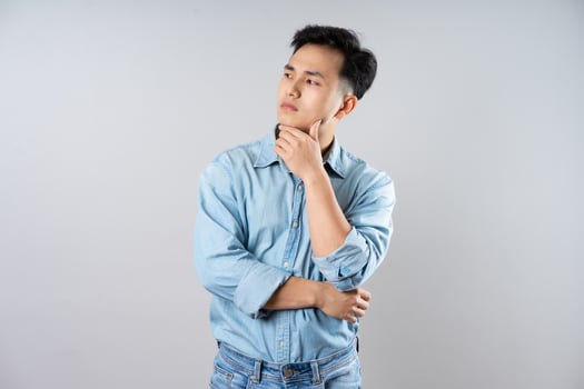 image of young businessman male on gray background photo