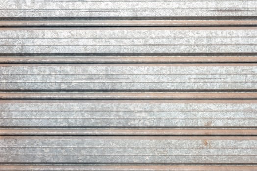 aged closeup metal garage door texture photo