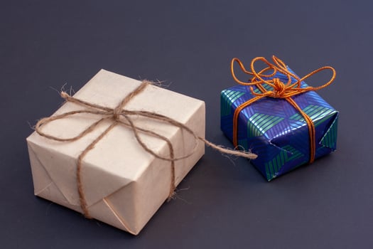 Two gift boxes on a dark background. photo