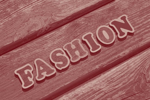word fashion on on old wooden bench photo