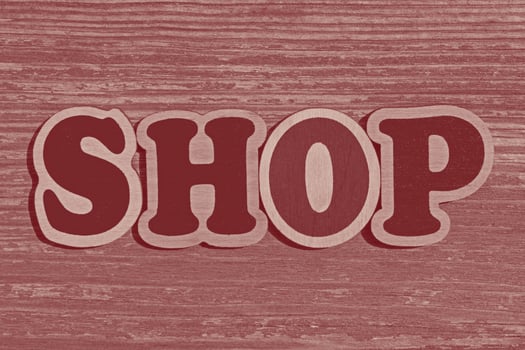word shop made of wooden letters on wood background photo