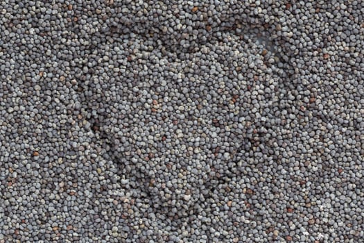 close up of heart made in poppy seeds photo