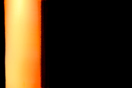 Blank grained and scratched film strip texture background with heavy grain, dust and a light leak Real Lens Flare Shot in Studio over Black Background photo