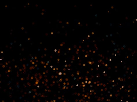abstract bokeh background of golden light burst made from bokeh motion. photo