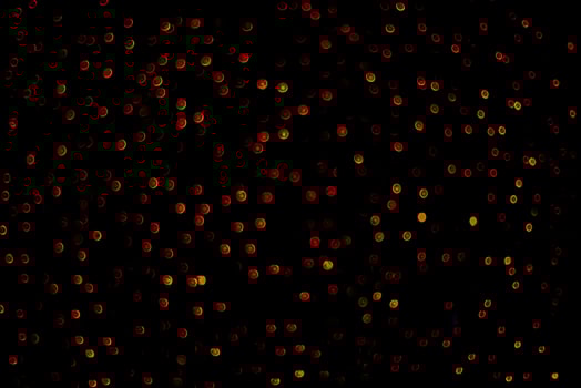 abstract bokeh background of golden light burst made from bokeh motion. photo