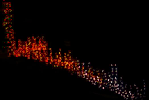 abstract bokeh background of golden light burst made from bokeh motion. photo
