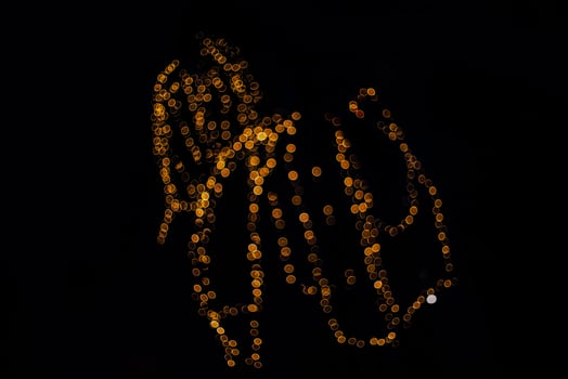 abstract bokeh background of golden light burst made from bokeh motion. photo