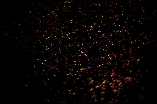 background of abstract glitter lights. gold and black. de focused photo