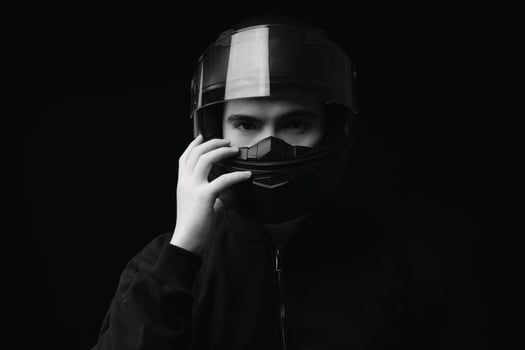 Image of young Asian man with helmet on background photo
