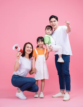 Young Asian family on background photo