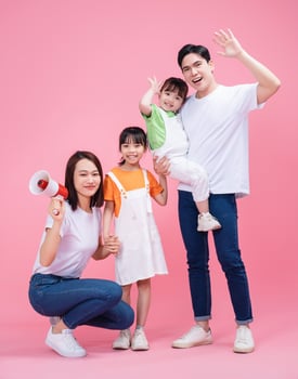 Young Asian family on background photo
