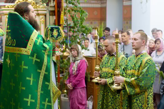 Palm Sunday.Orthodox priest on the background of parishioners on Palm Sunday. photo
