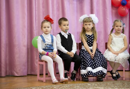 Funny children from kindergarten at the matinee. photo