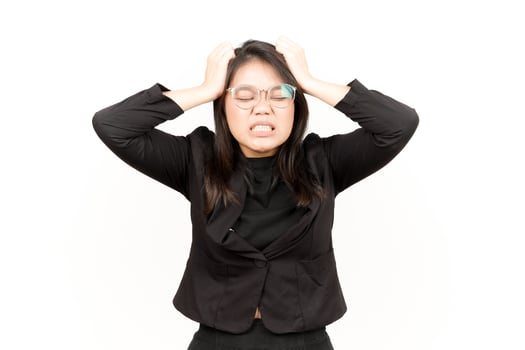 Suffering Headache Of Beautiful Asian Woman Wearing Black Blazer Isolated On White Background photo