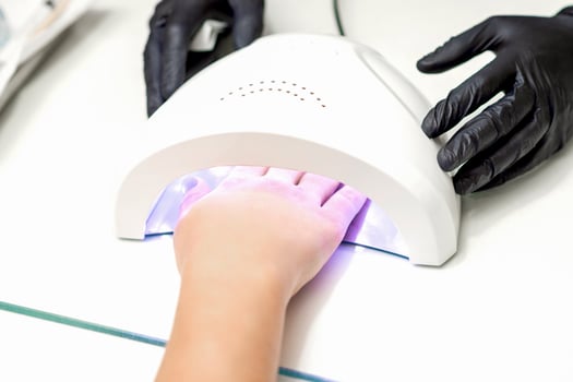 Hand inside of UV lamp photo