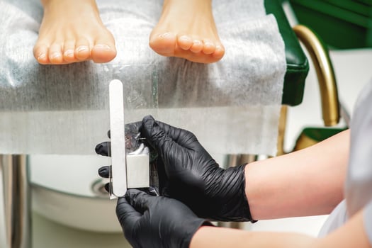 Nail file tool in hands photo