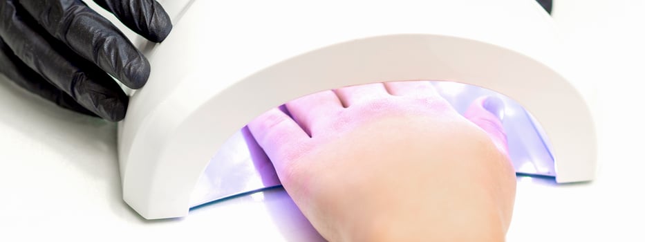 Hand inside of UV lamp photo