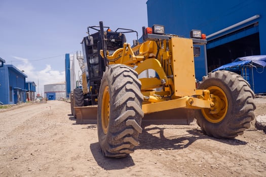 Land scraper and Vibro roller the heavy equipment for pretreatment road construction. The photo is suitable to use for industry background photography, power plant poster and electricity