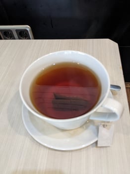 Close up a cup hot tea with fresh sugar. The photo is suitable to use for fresh drink background and content media.