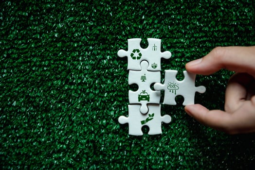Companies are targeting net zero greenhouse gas emissions. Carbon credit conceptTradable certificate to drive industry in direction of low emissions in efficiency costJigsaw puzzle with decrease CO2 photo