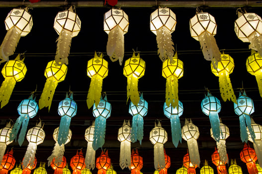 colorful hanging lanterns lighting on night sky in loy krathong festival at northern of thailand photo