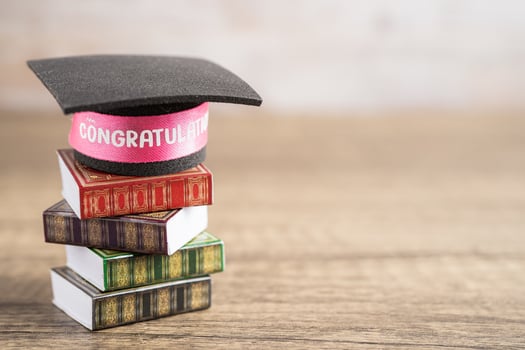 Graduation hat on book with copy space, learning university education concept. photo