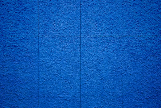 Rough textured blue wall composed of stone slabs photo