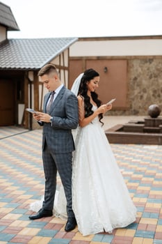 the first meeting of the bride and groom in the courtyard of the hotel photo